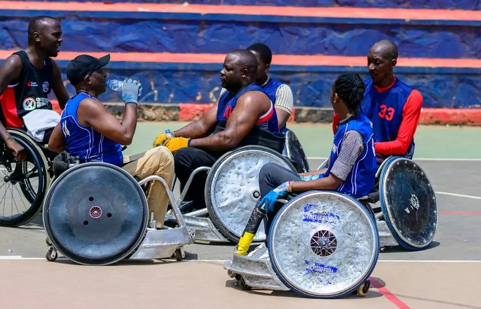 Wheelchair rugby athletes taking part in a coached court session in Kampala
