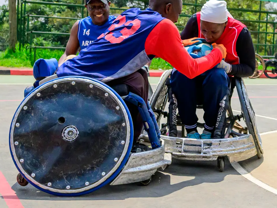 Wheelchair rugby athletes contesting the ball