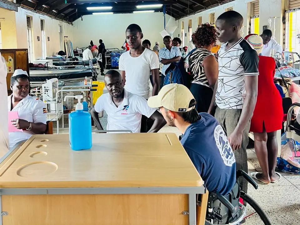 UWRF representatives and families speaking in a hospital ward