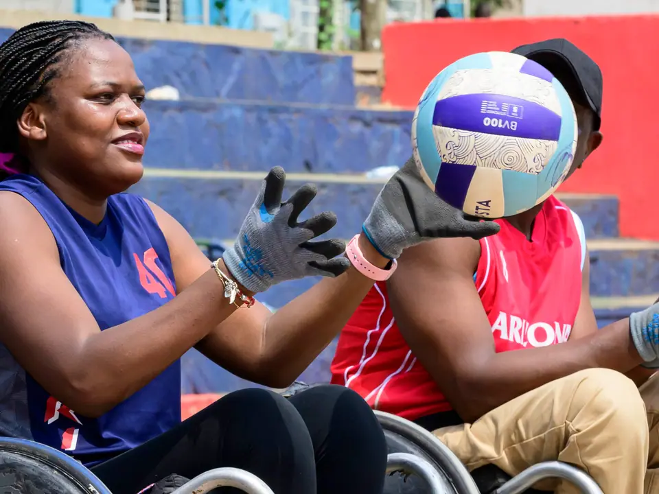 Wheelchair rugby athlete preparing to receive a ball
