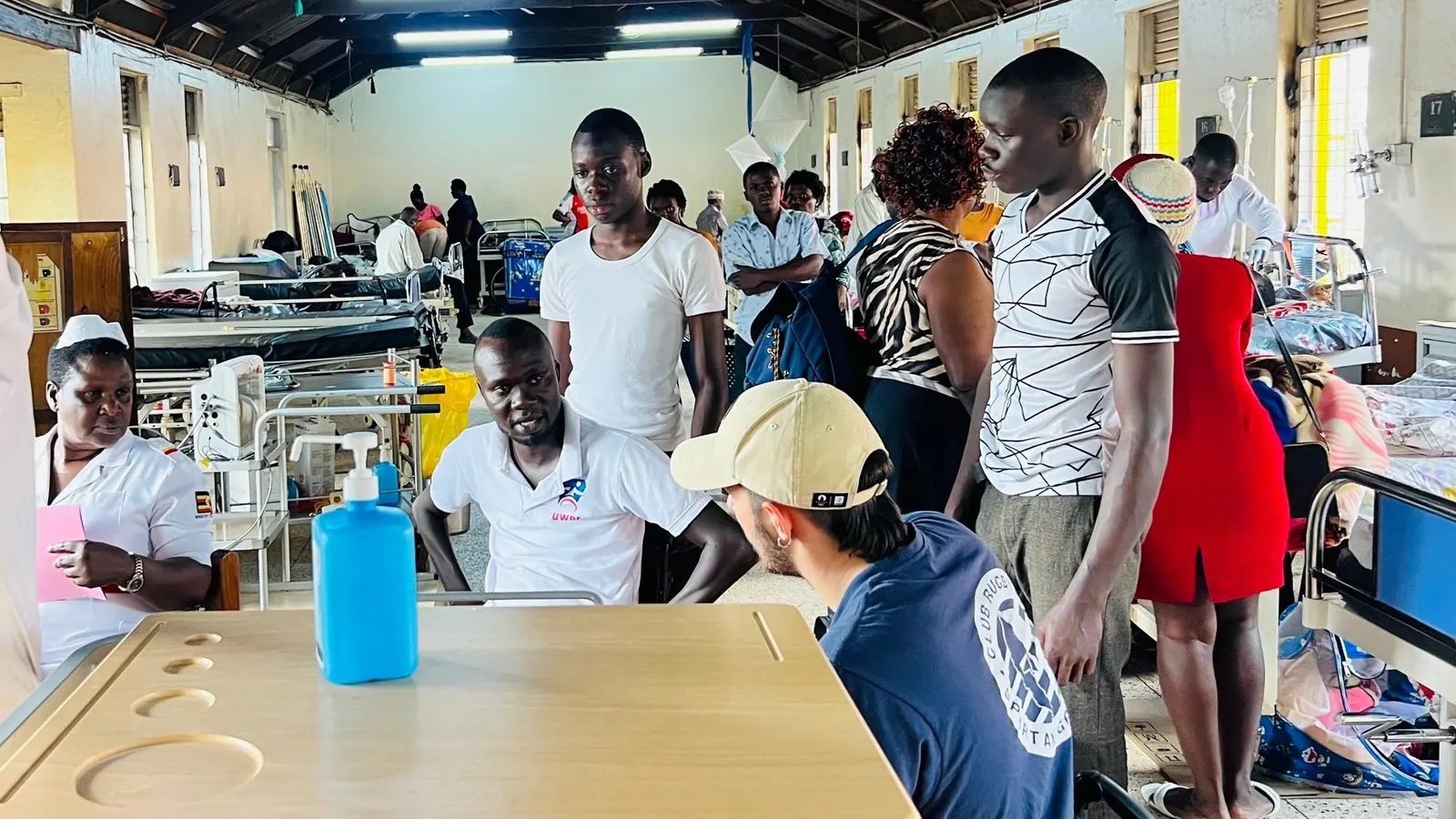 UWRF representatives speaking with people during a hospital programme