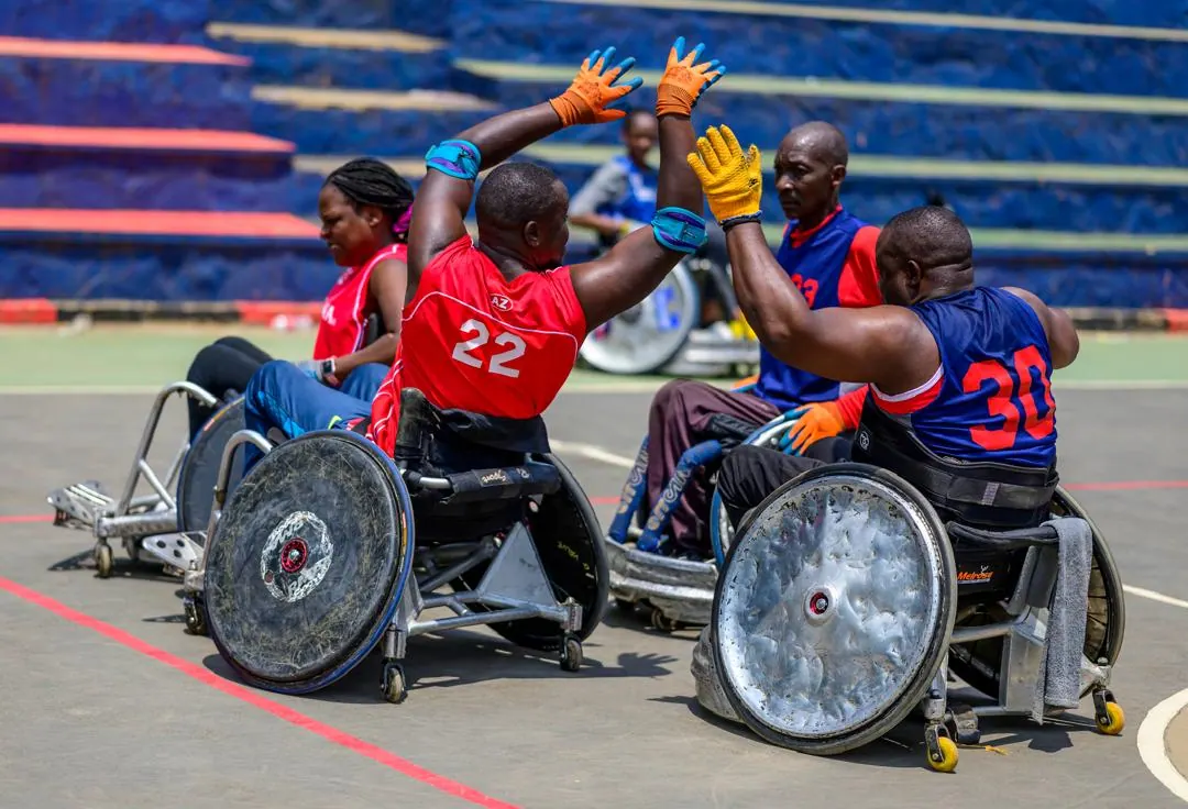Wheelchair rugby athletes in a competitive contact drill