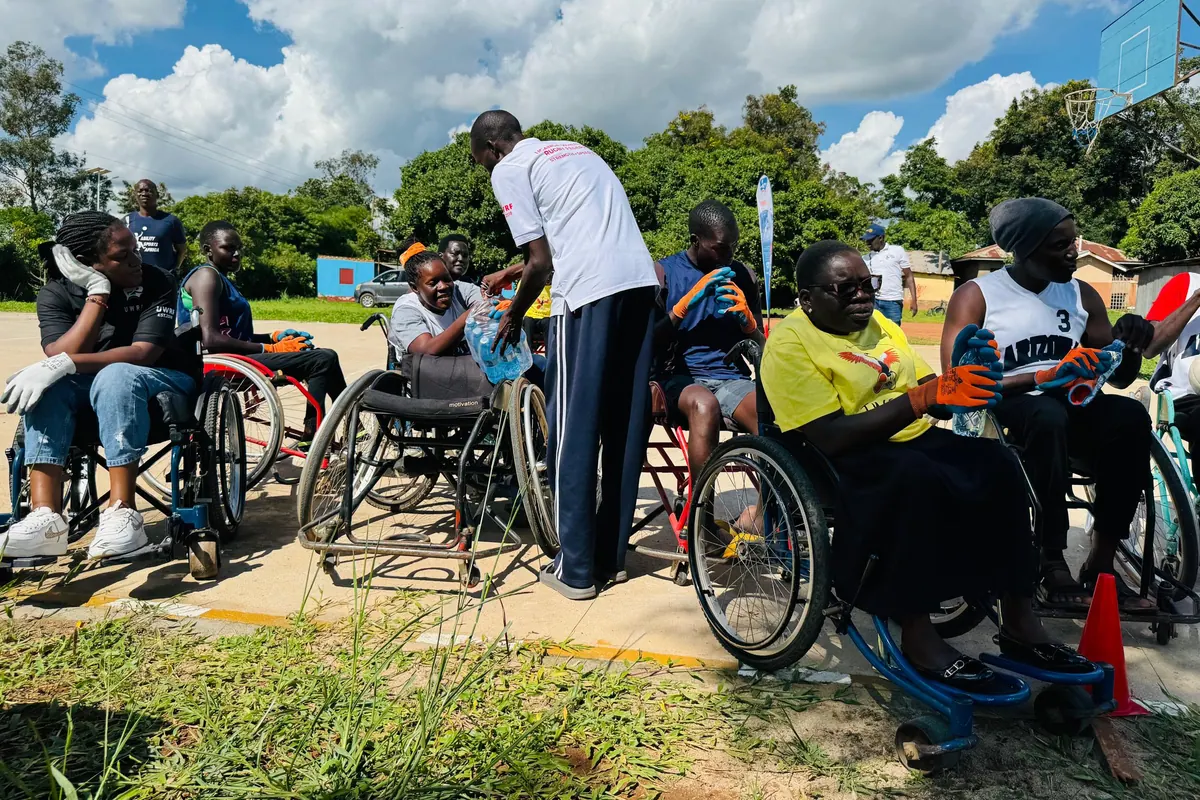 Wheelchair rugby participants gathered during UWRF regional development in Gulu